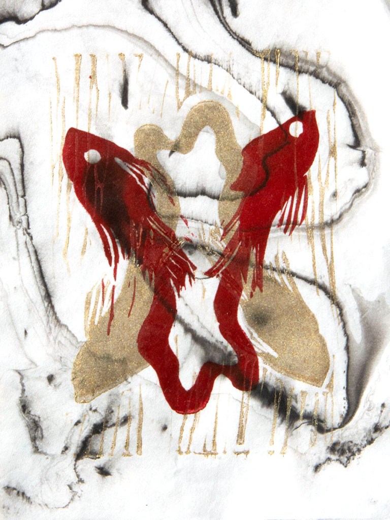 Two fish joined at the tail, flipped over a gold pair of fish