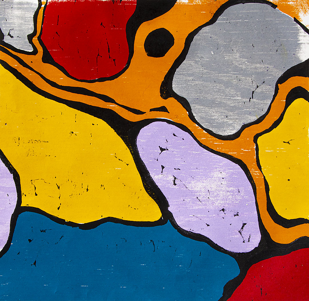 brightly colored jigsaw print, reds, light violet, yellow, blue, & gray